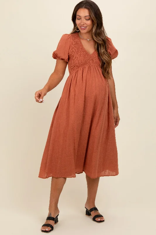 Polka - dot midi dress for a cute and retro lookRust Smocked V-Neck Puff Sleeve Maternity Midi Dress