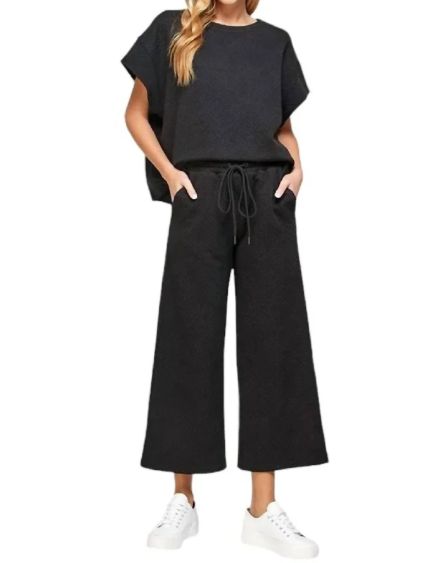 Embroidered linen pants for women in a natural styleTextured Short Sleeve And Cropped Flare Pant Set In Black Embroidered linen pants for women in a natural styleTextured Short Sleeve And Cropped Flare Pant Set In Black