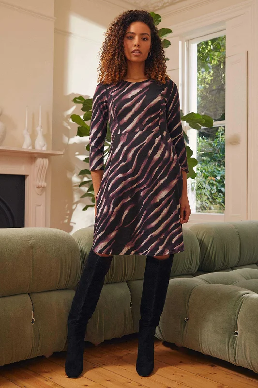 Dresses with Sheer Panels and Beaded Trim and Embroidered Paisley Patterns for Ladies' Sultry and Exotic LookPrinted Twist Back Skater Dress Dresses with Sheer Panels and Beaded Trim and Embroidered Paisley Patterns for Ladies' Sultry and Exotic LookPrinted Twist Back Skater Dress